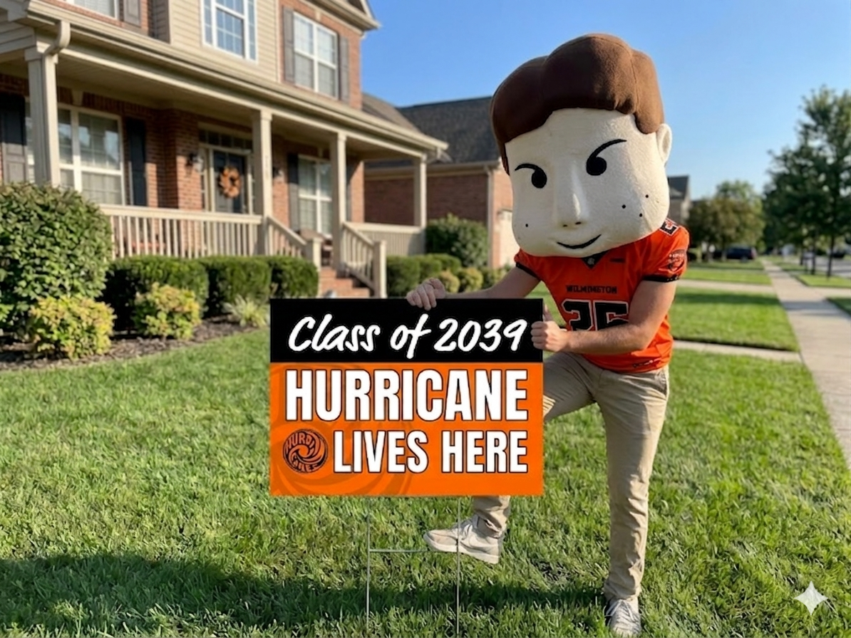 huffy putting a class of 2039 yard sign in a yard